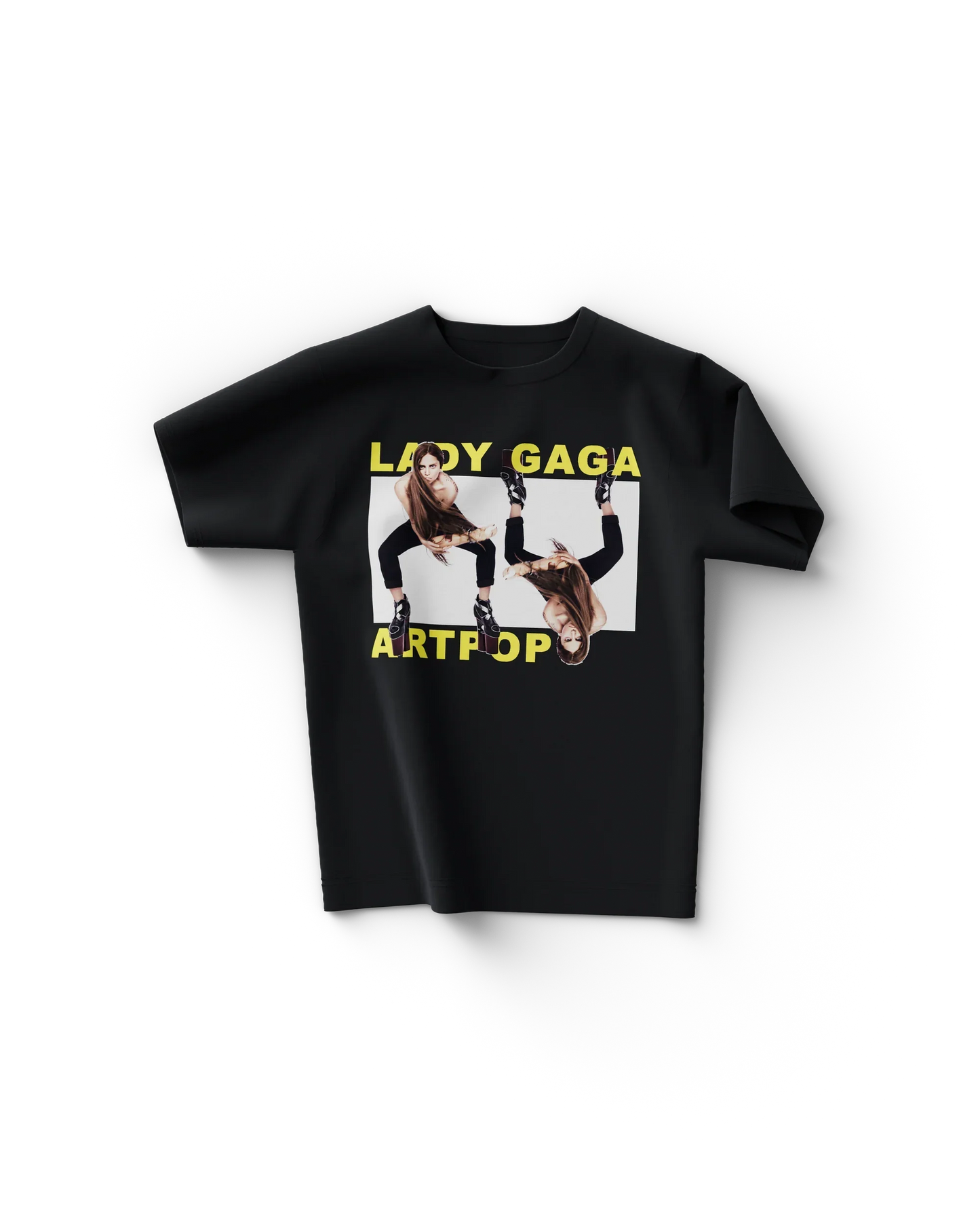 Black Lady Gaga merch t shirt front view with yellow "LADY GAGA ARTPOP" text and mirrored leg pose graphic in center