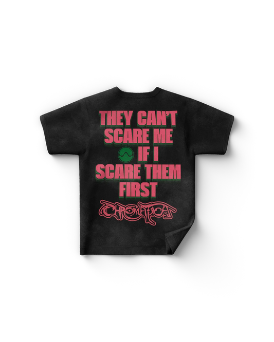 Black Lady Gaga merch t shirt back view with bold text "THEY CAN'T SCARE ME IF I SCARE THEM FIRST" and "CHROMATICA" logo