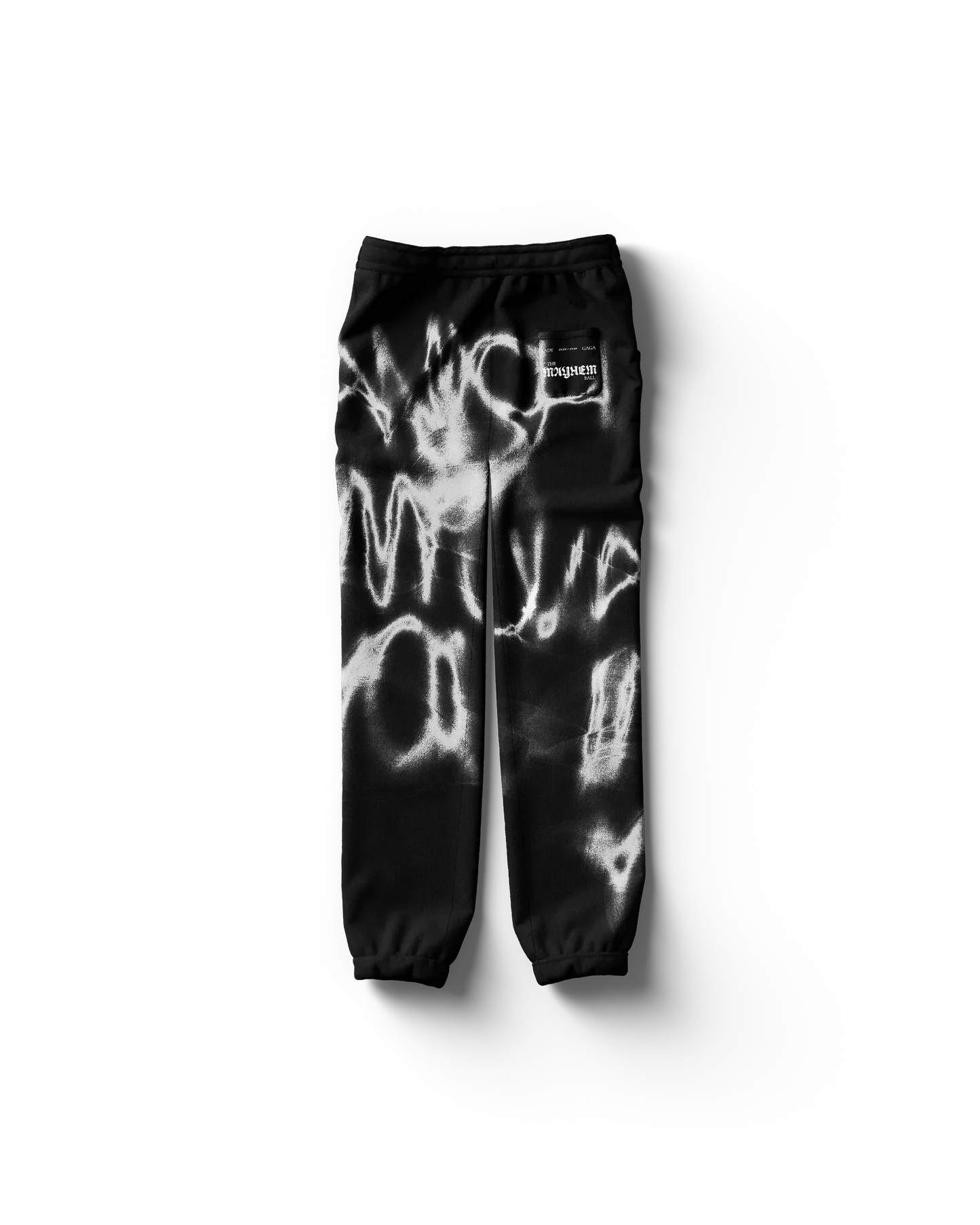 Black Lady Gaga sweatpants back view featuring abstract white spray paint pattern and subtle logo patch, bold Gaga merch streetwear style