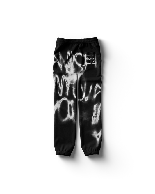 Black Lady Gaga sweatpants back view featuring abstract white spray paint pattern and subtle logo patch, bold Gaga merch streetwear style