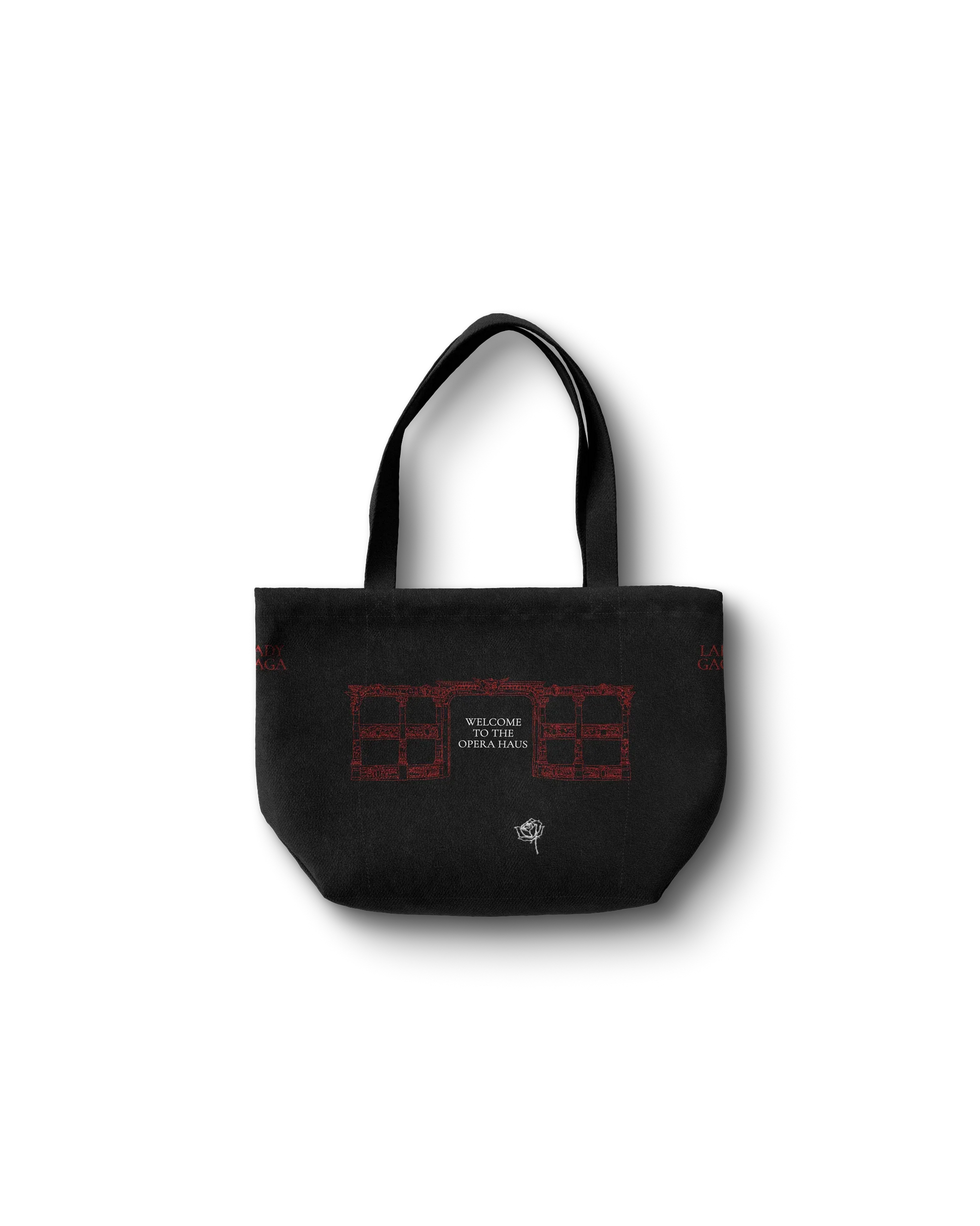 Lady Gaga black Opera Haus tote bag back featuring red “Welcome to the Opera Haus” architectural illustration with rose detail
