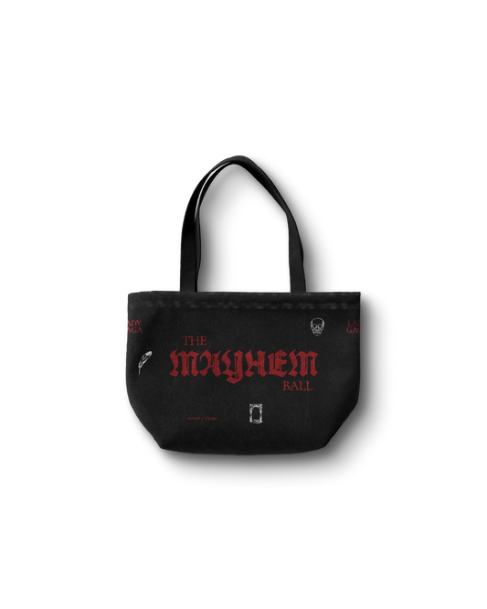Lady Gaga black Opera Haus tote bag front featuring “The Mayhem Ball” red gothic text with small graphic icons on canvas