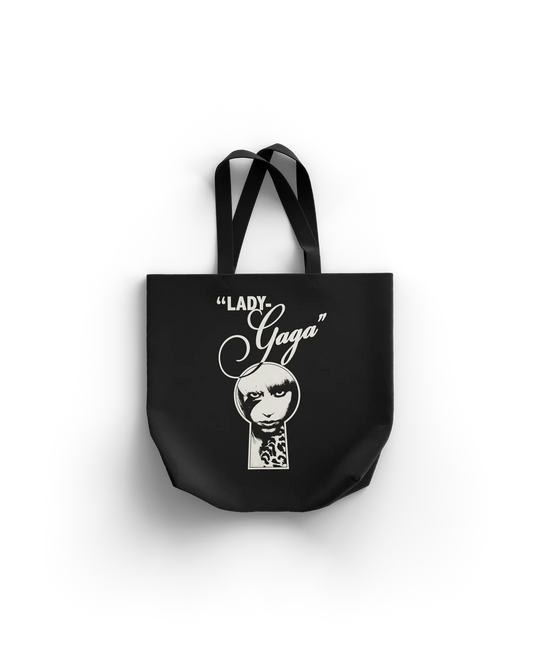 Lady Gaga Keyhole Boys tote bag front featuring keyhole face graphic with “Lady Gaga” script text on black canvas
