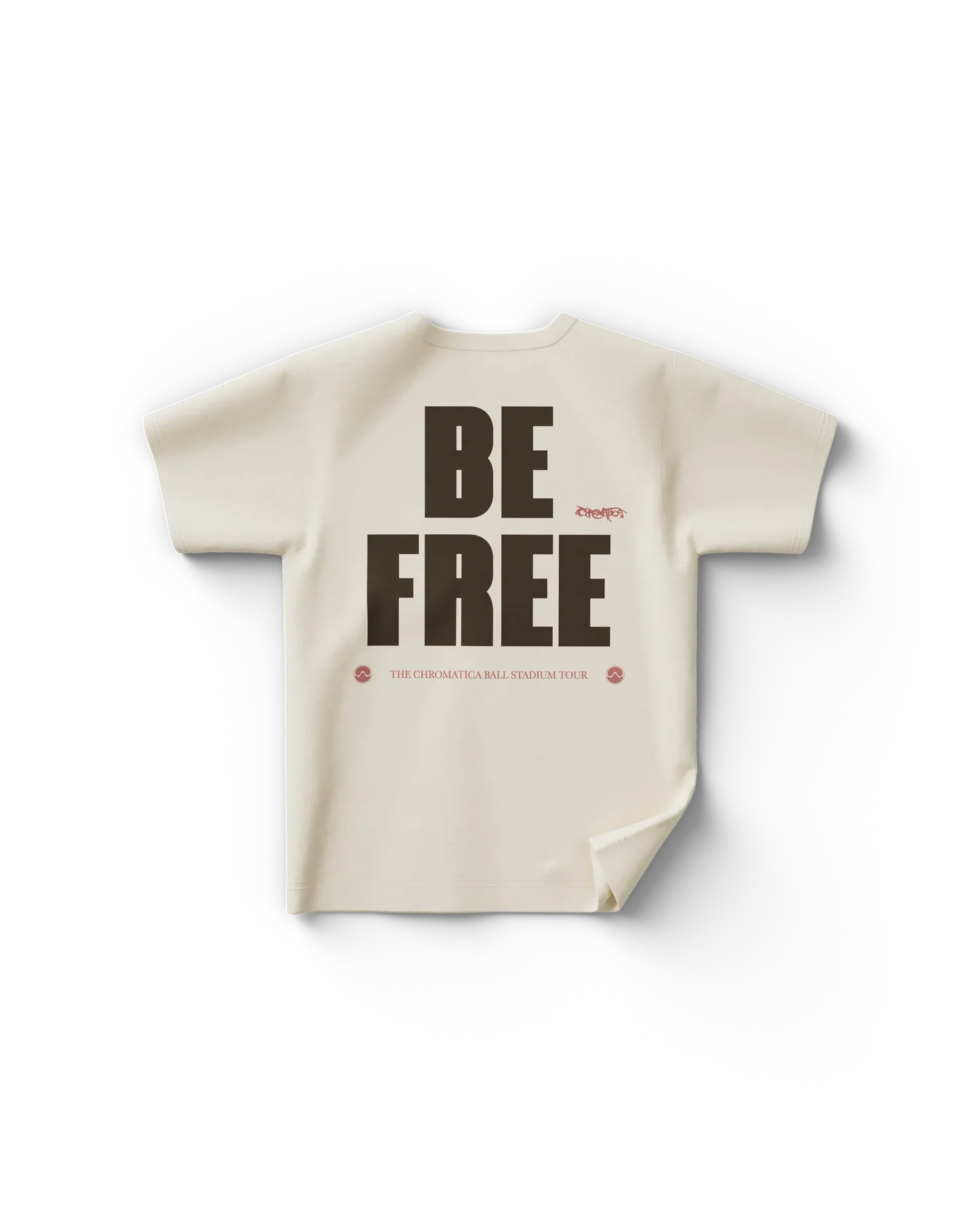 Cream Lady Gaga merch t shirt back view with bold text "BE FREE" and smaller text "THE CHROMATICA BALL STADIUM TOUR"