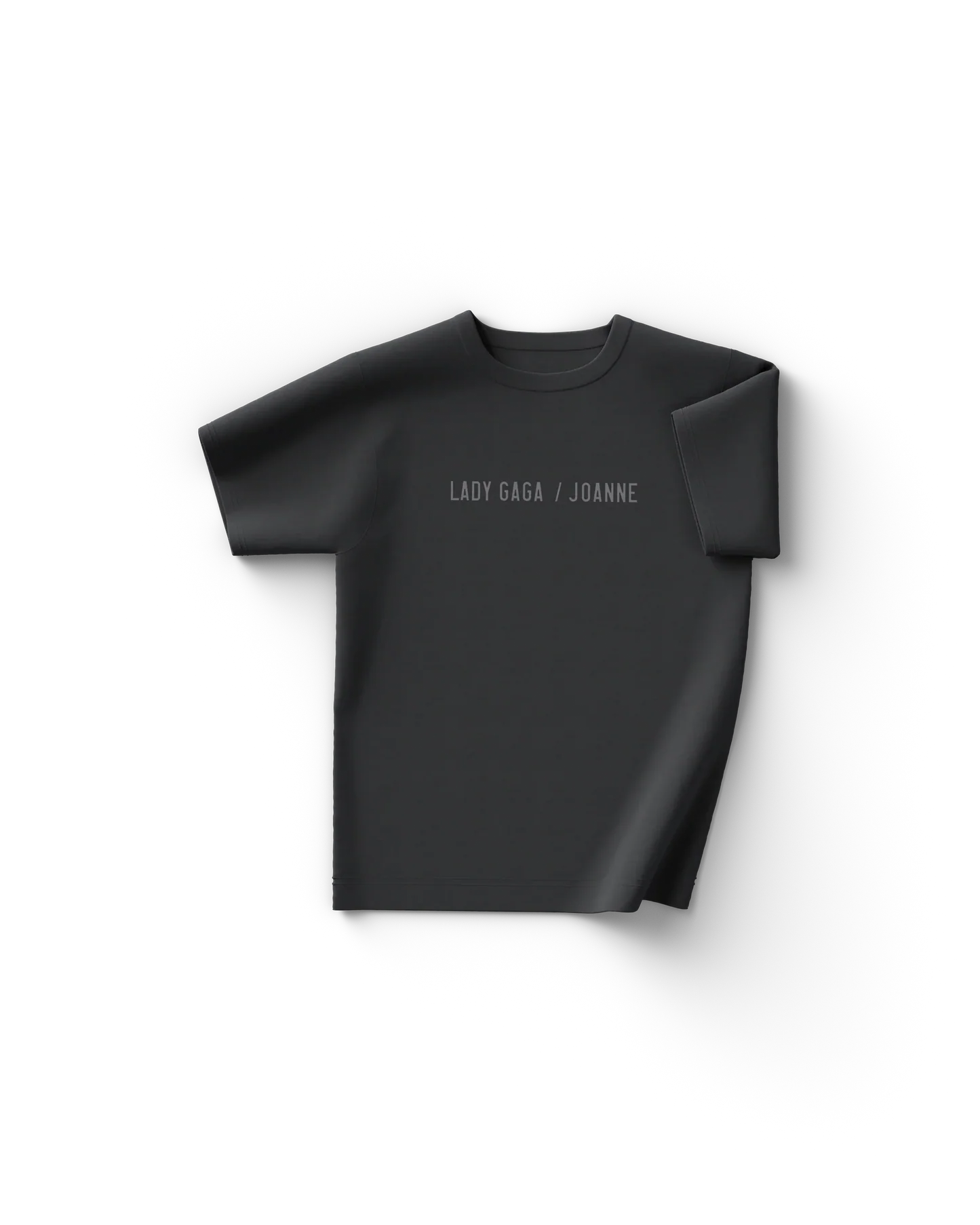 Black Lady Gaga t shirt front view with minimal text "Lady Gaga / Joanne" across the chest