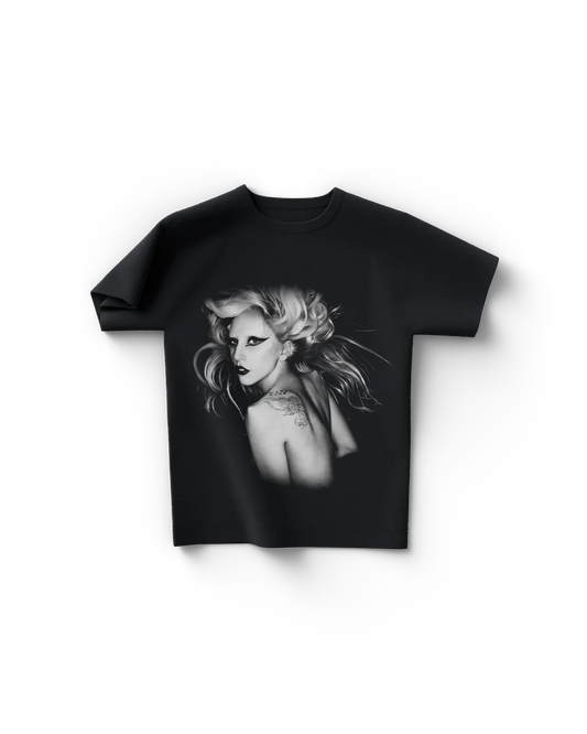 Black Lady Gaga t-shirt front view featuring a black-and-white portrait of Lady Gaga with dramatic makeup and flowing hair