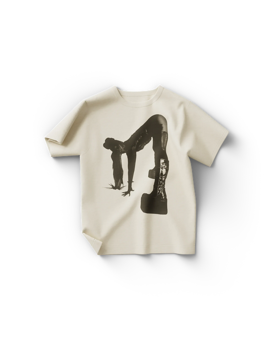 Cream Lady Gaga merch t shirt front view with black graphic of Gaga bent forward in platform boots and bodysuit pose