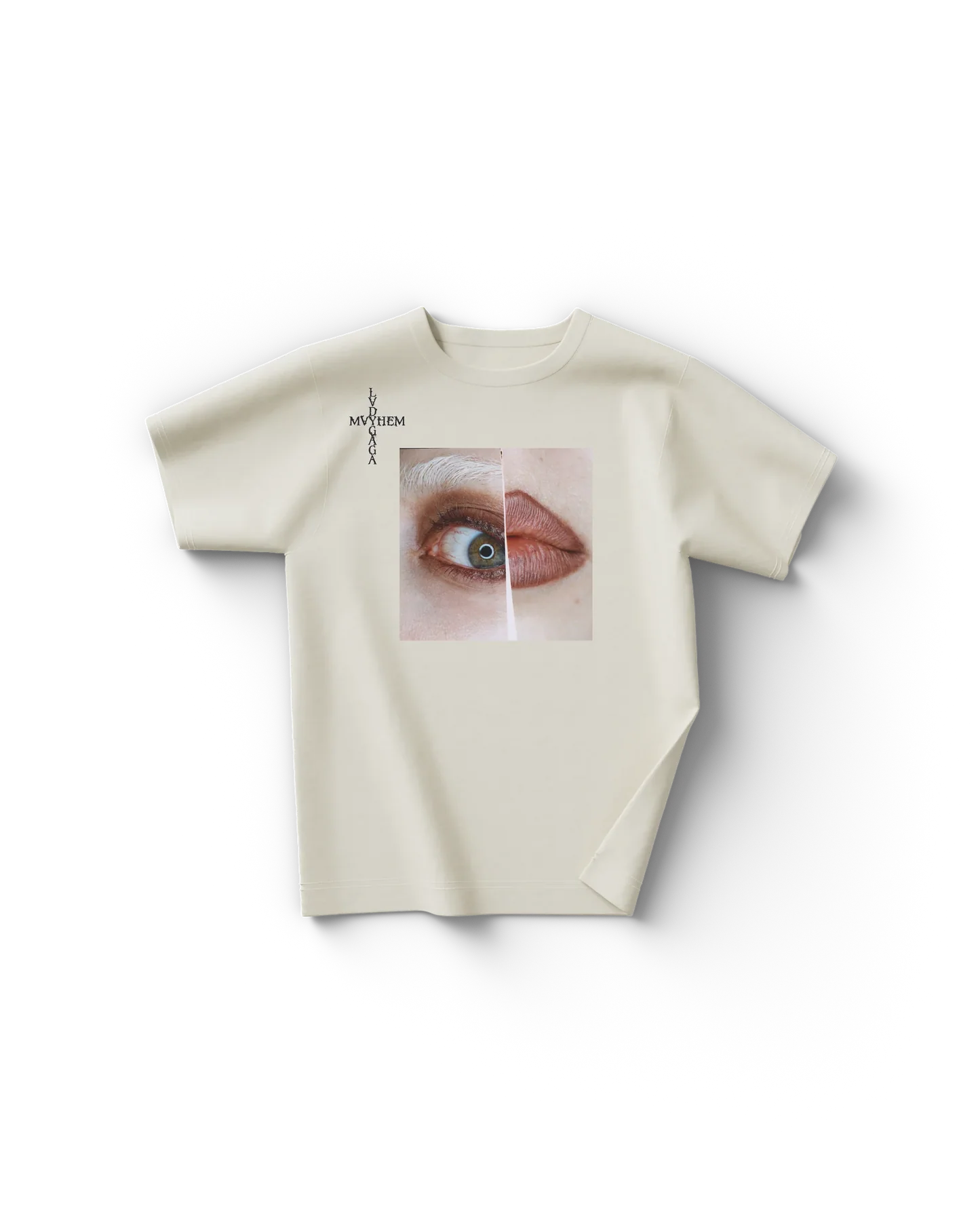 Cream Lady Gaga t shirt front view with split close-up graphic of eye and lips and vertical "Lady Gaga Mayhem" text on chest