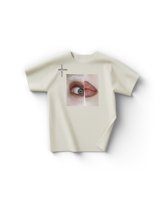 Cream Lady Gaga t shirt front view with split close-up graphic of eye and lips and vertical "Lady Gaga Mayhem" text on chest