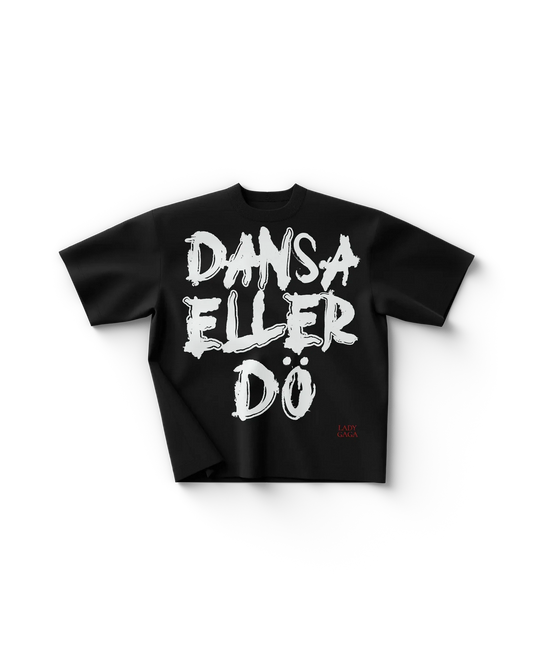 Black Lady Gaga t shirt front view with bold handwritten “DANSA ELLER DÖ” text in white, edgy Gaga merch design with small red logo detail