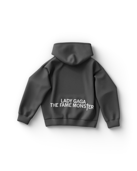 Dark gray Lady Gaga hoodie back view with "Lady Gaga The Fame Monster" text in white