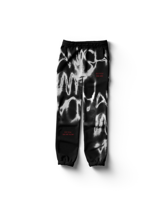 Black Lady Gaga merch sweatpants front view with abstract white graffiti pattern and red “Do You See Me” text, edgy Gaga streetwear design