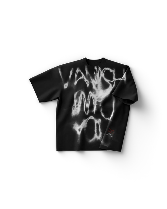 Black Lady Gaga t-shirt front view featuring abstract white spray-paint “Vanish Into You” style graphic with small red text detail
