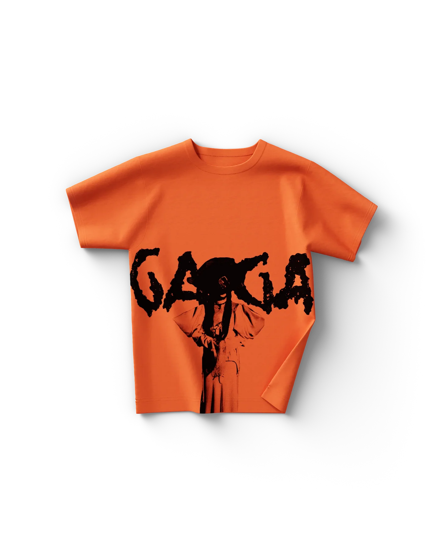 Lady Gaga orange pose t-shirt front featuring bold “Gaga” text with dramatic black silhouette graphic design