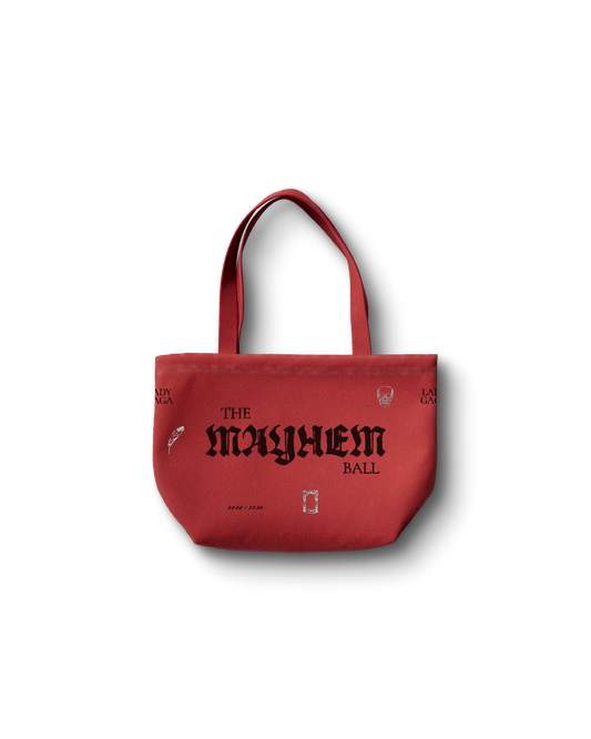 Lady Gaga red Opera Haus tote bag front featuring “The Mayhem Ball” gothic text with small graphic icons on canvas